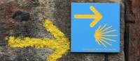 Portuguese Camino sign showing the way to Santiago de Compostela in Spain | Jaclyn Lofts
