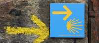 Portuguese Camino sign showing the way to Santiago de Compostela in Spain | Jaclyn Lofts
