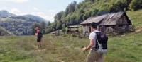 walking past simple farmhouses in Transylvania | Kate Baker