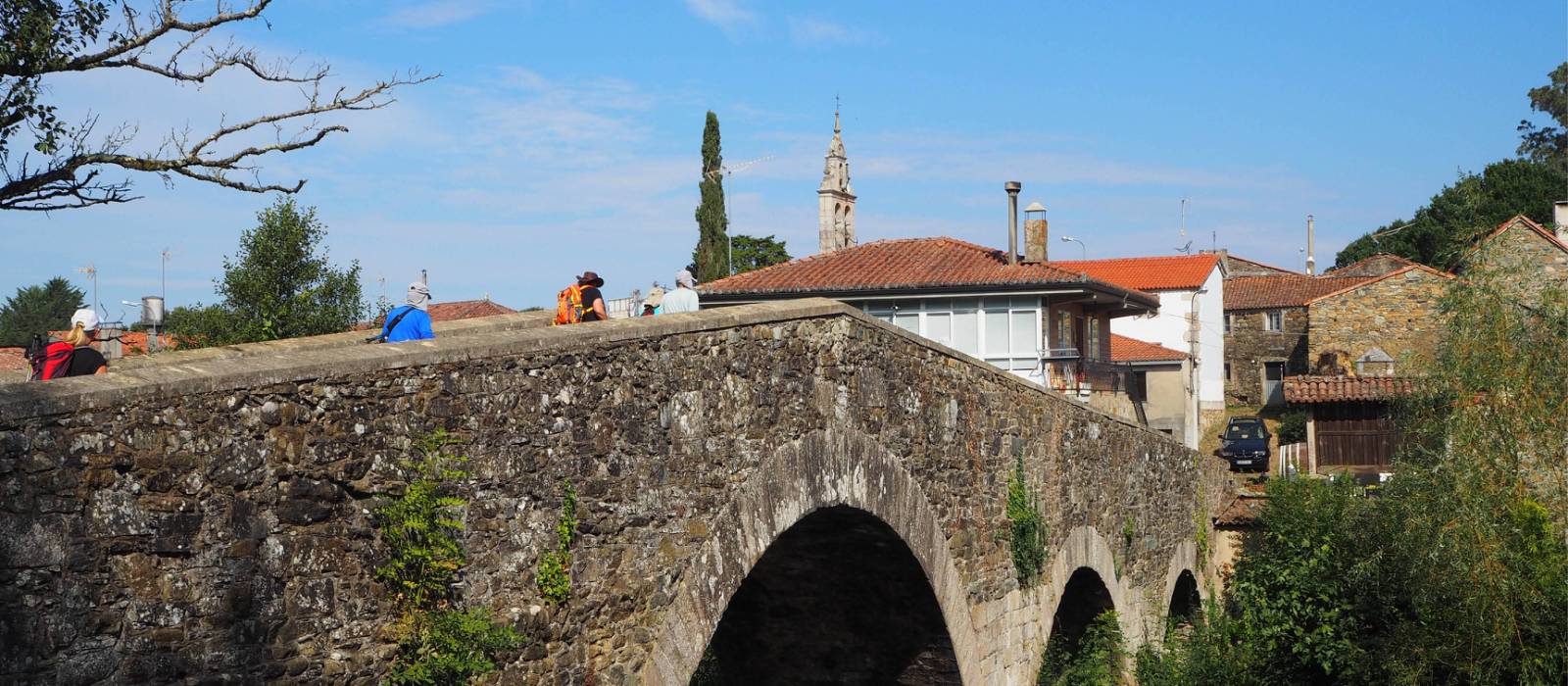 The ancient arched bridge leading pilgrims into Melide | Sue Finn