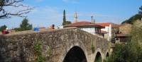 The ancient arched bridge leading pilgrims into Melide | Sue Finn