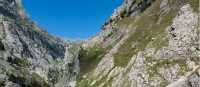 Hiking in the rugged terrain of the Picos de Europa in Spain | Dkatana