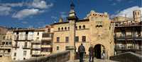 Hikers on the medieval bridge leading to Valderrobres | Kate Baker