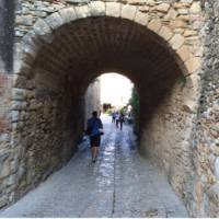 Laneway in the medieval village of Peratallada, visited on a self guided cycle trip in Catalonia | Kate Baker