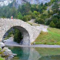 Walker crossing the puente bujaruelo in the Ordesa Canyon