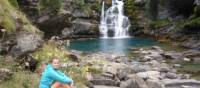 Walking resting at a waterfall in the Ordesa Canyon