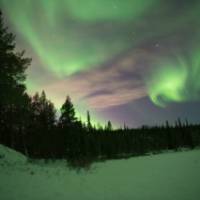 Swirling northern lights in Swedish Lapland | Ross Baker