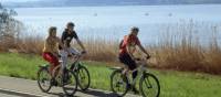 Cycling along the lake in middle Switzerland