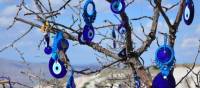 A tree full of evil-eye charms | Erin Williams