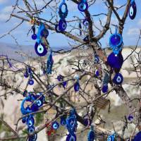 A tree full of evil-eye charms | Erin Williams