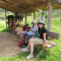 Walkers resting at a shepherds hut | Kate Baker