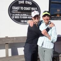 Happy hikers at the end of the Coast to Coast Trail in Robin Hood's Bay | John Millen