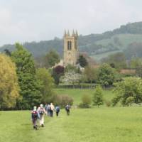 A group of walkers arrives in Broadway in the Cotswolds