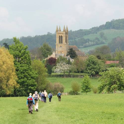 A group of walkers arrives in Broadway in the Cotswold