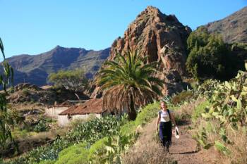 A hiker walking through Benchijigua in Gomera