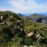 Walkers heading round the coast to Cala Codolar | John Millen