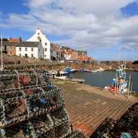 Reach lively Crail harbour on foot