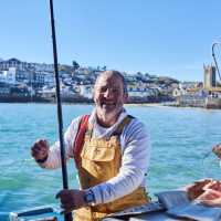 A happy Cornish fisherman in St Ives | Visit Britain