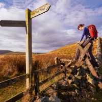 Crossing a stile on the Pennine Way | Duncan Andison