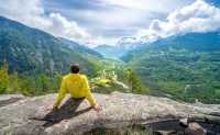 A hiker taking in the sweeping alpine views of Écrins National Par |  Guillaume Galvani