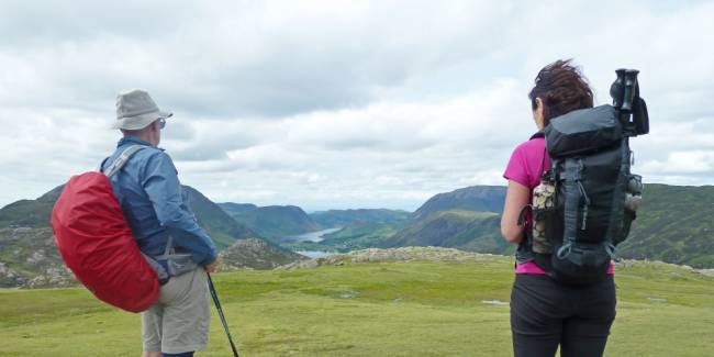 A couple of hikers take in scenes on England's beautiful Lake District