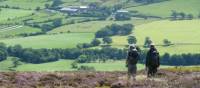 A couple enjoying the beautiful scenery on Wainwright's Coast to Coast | John Millen