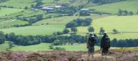 A couple enjoying the beautiful scenery on Wainwright's Coast to Coast | John Millen