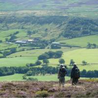 A couple enjoying the beautiful scenery on Wainwright's Coast to Coast | John Millen