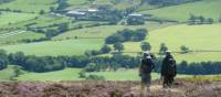 A couple enjoying the beautiful scenery on Wainwright's Coast to Coast | John Millen