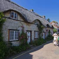 Walkers on the street in charming Brighstone Village, Isle of Wight | visitisleofwight.co.uk
