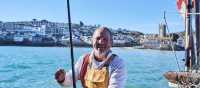 A happy Cornish fisherman in St Ives | Visit Britain