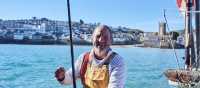 A happy Cornish fisherman in St Ives | Visit Britain
