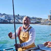 A happy Cornish fisherman in St Ives | Visit Britain