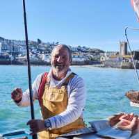 A happy Cornish fisherman in St Ives | Visit Britain