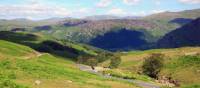 Cyclist on the road up from Borrowdale to the Honister pass | John Millen