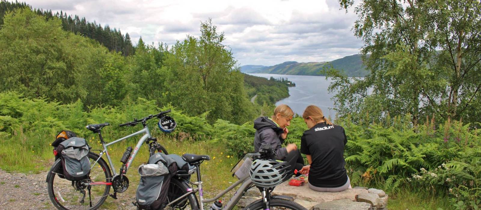 Cyclists overlooking Great Glen & Loch Ness in Scotland | Janette Crighton
