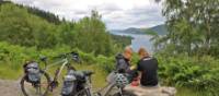 Cyclists overlooking Great Glen & Loch Ness in Scotland | Janette Crighton