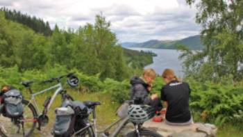 Cyclists overlooking Great Glen & Loch Ness in Scotland | Janette Crighton
