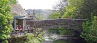 Walkers taking a rest at Grasmere Bridge on the Coast to Coast trail | John Millen