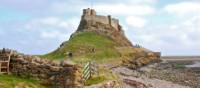 Walkers on the Lindisfarne Causeway to Holy Island, Northumberland | yorkshireman