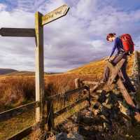 Crossing a stile on the Pennine Way | Duncan Andison