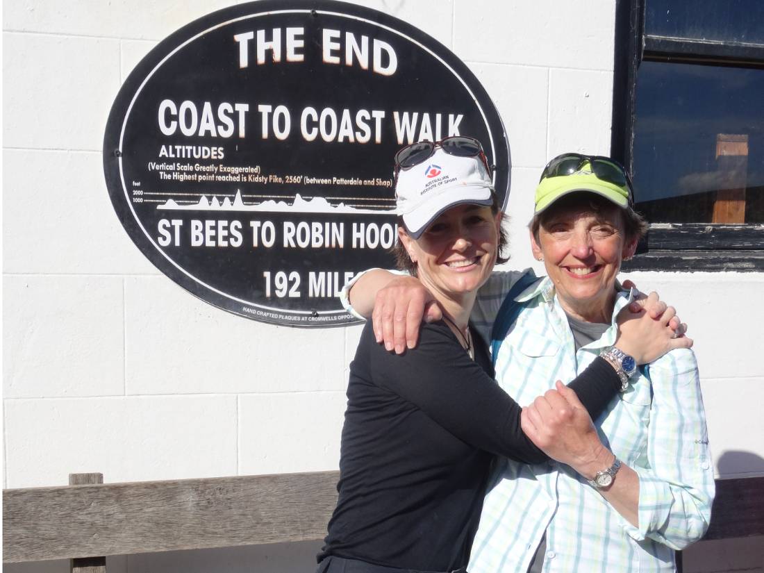 Happy hikers at the end of the Coast to Coast Trail in Robin Hood's Bay |  <i>John Millen</i>