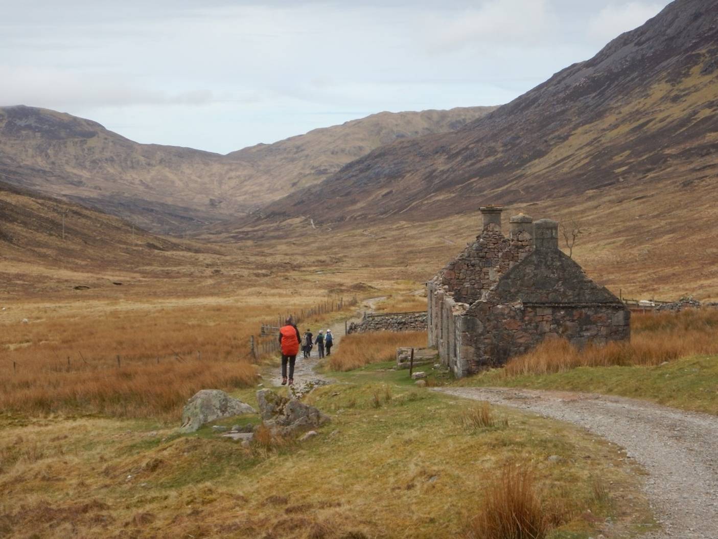 Other walkers and another old farmhouse (Tigh-na-sleubhaich) on the old military road in the glen, surrounded by mountains, between Kinlochleven and Fort William (Day 8). | <i>Peter Wells</i>