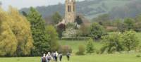 A group of walkers arrives in Broadway in the Cotswold