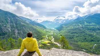 A hiker taking in the sweeping alpine views of Écrins National Par | Guillaume Galvani