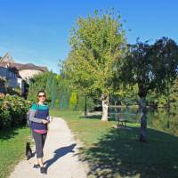 A walker on the towpath beside the Dordogne River in Beaulieu-sur-Dordogne | Nathalie Thomson