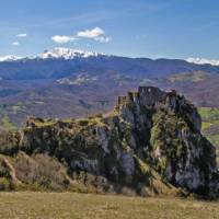The ruins of chateau Roquefixade with the Pyrenees in the background | Jcb-caz-11
