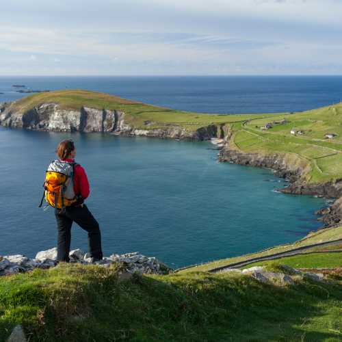 Hiker enjoying the view from Slea Head, Dingle