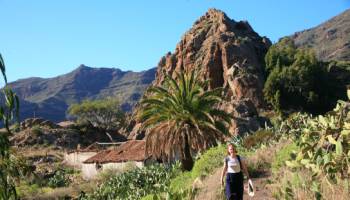 A hiker walking through Benchijigua in Gomera