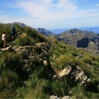 Walkers heading round the coast to Cala Codolar | John Millen